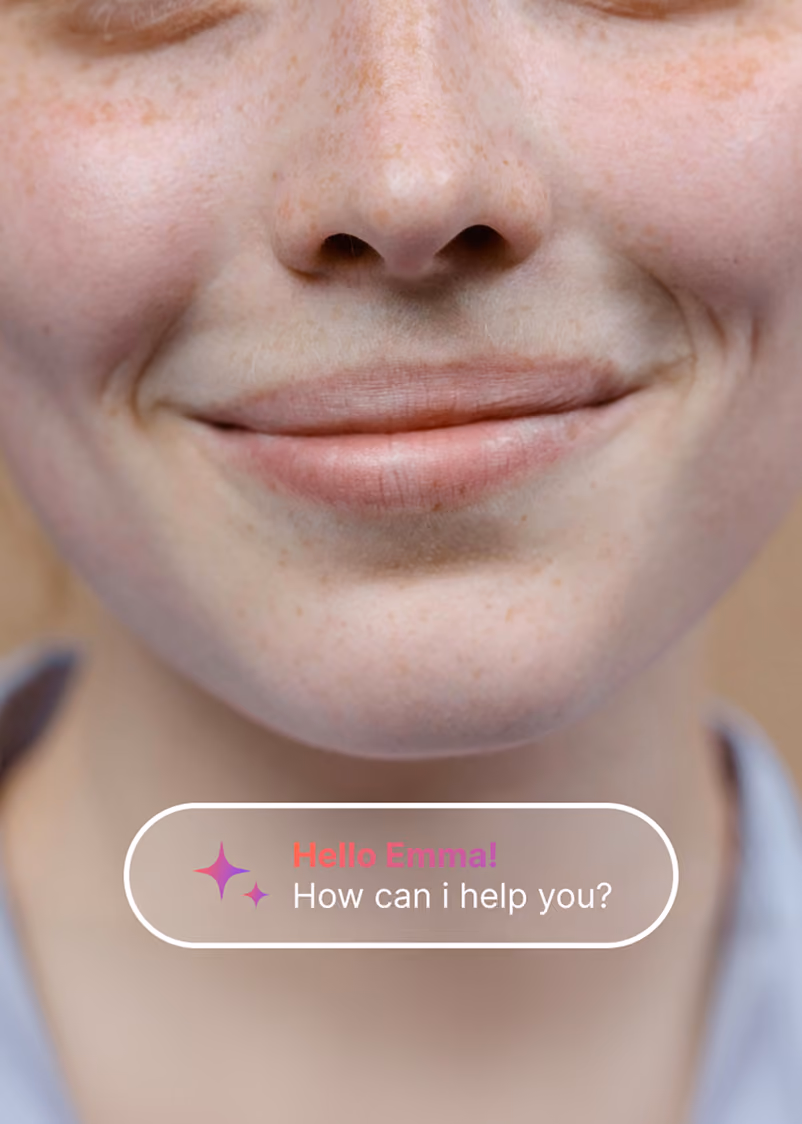 Close-up of a smiling person's lower face and nose with chat text: Hello Emma! How can I help you?